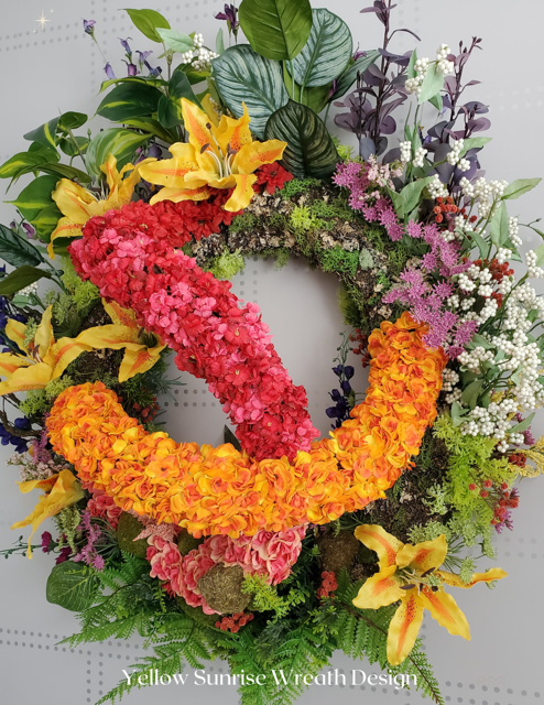 Botanical Garden — Yellow Sunrise wreath with yellow lilies, red and orange hydrangea, and mixed foliage.