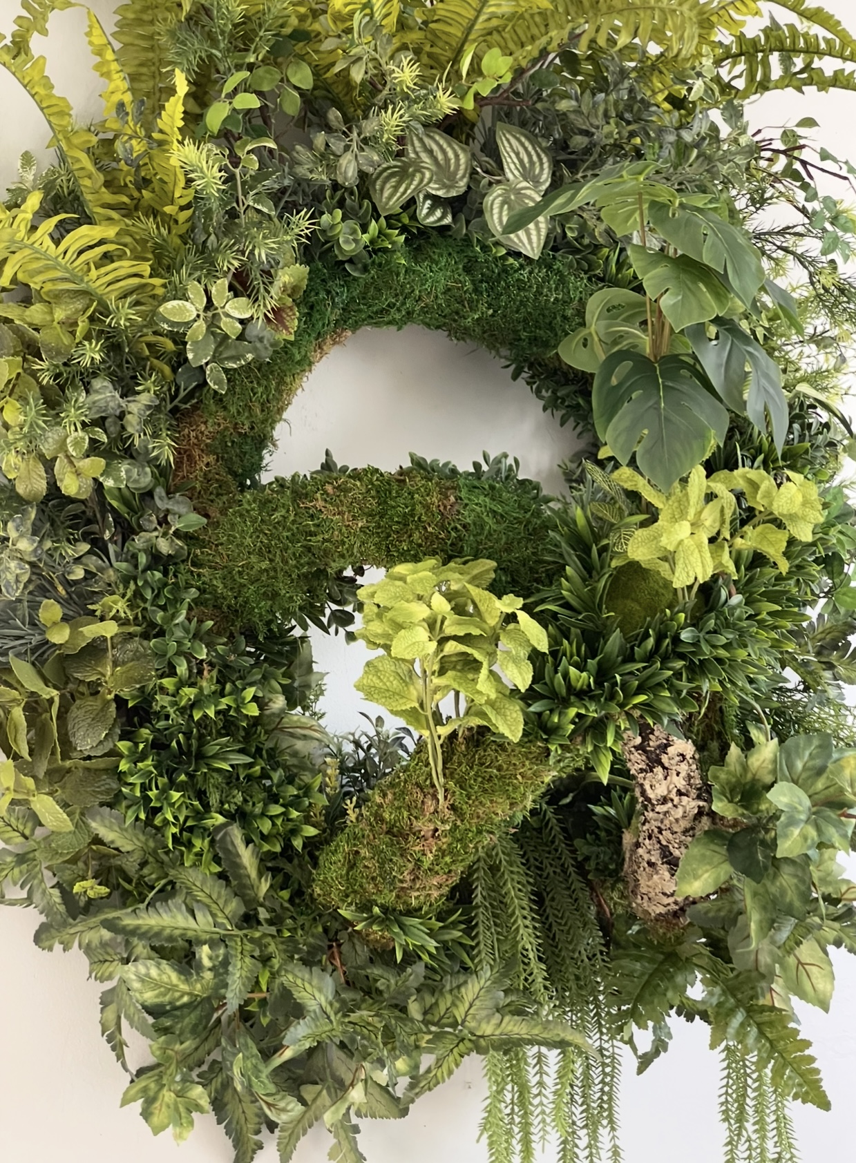 Biophilic Biosphere Dome Wreath — full unit detail showing ferns, moss, monstera, and layered foliage.
